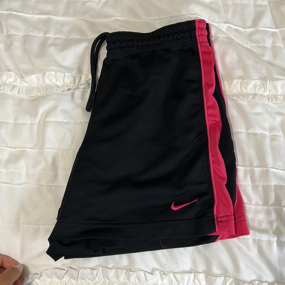 Black and pink Nike athletic shorts with draw string